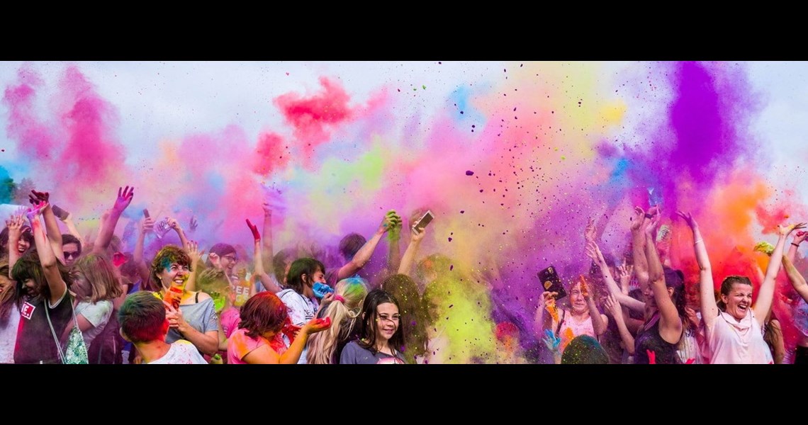 A decorative image of people at a festival