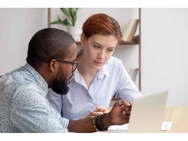 An image of a student and personal tutor engaged in conversation